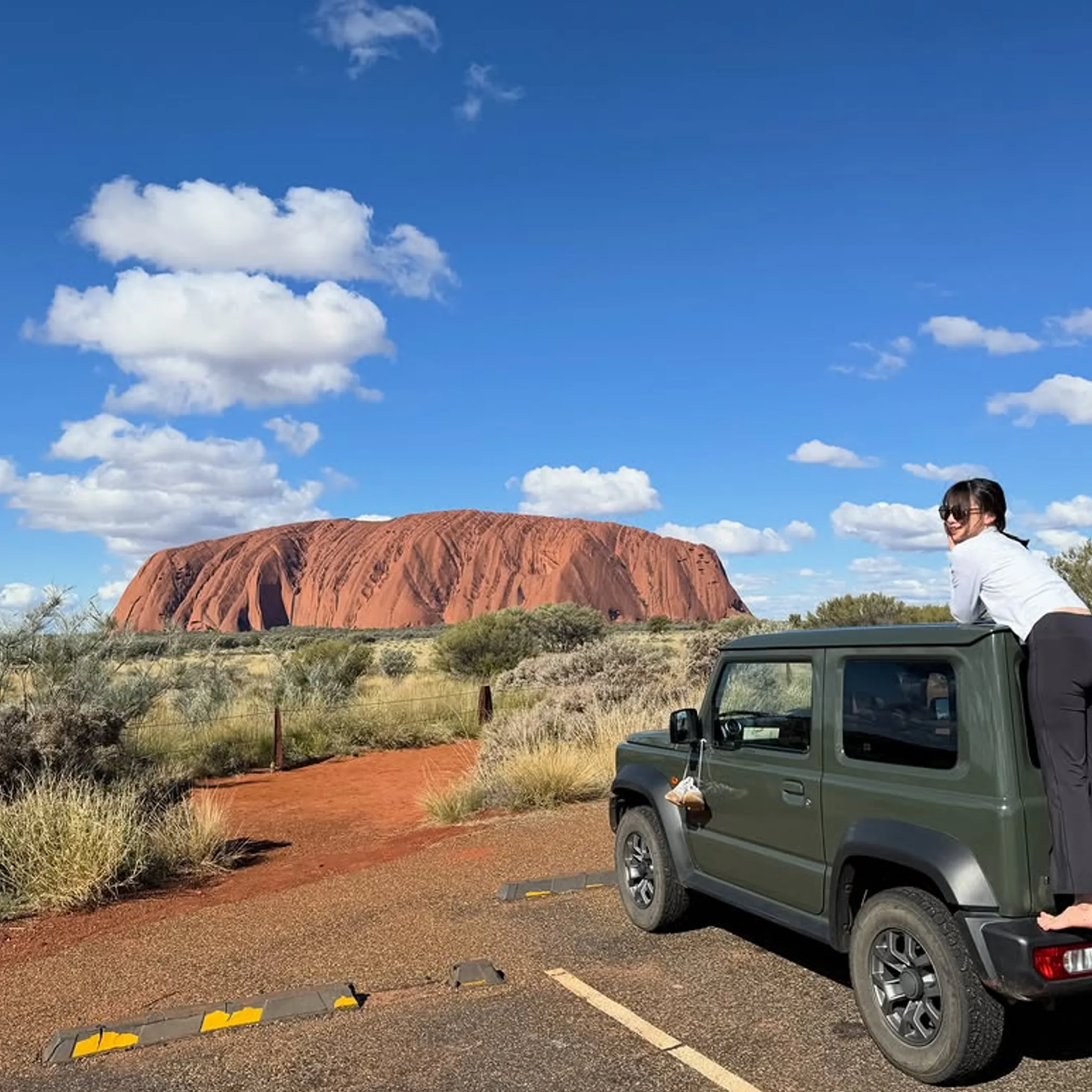 uluru rock formation under clear sky